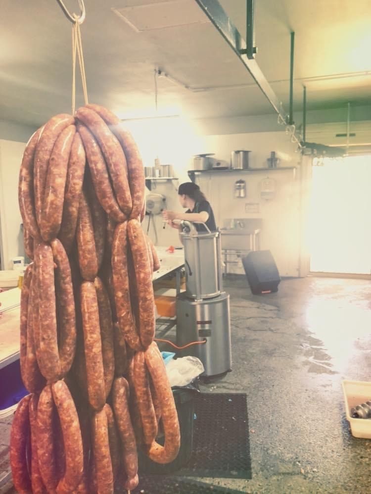 Sausages hanging in the butcher's workroom